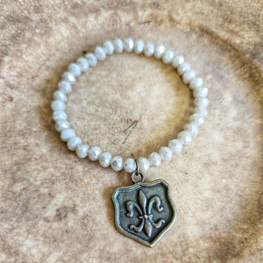 Stretch Bracelet with Fleur de lis shield Charm